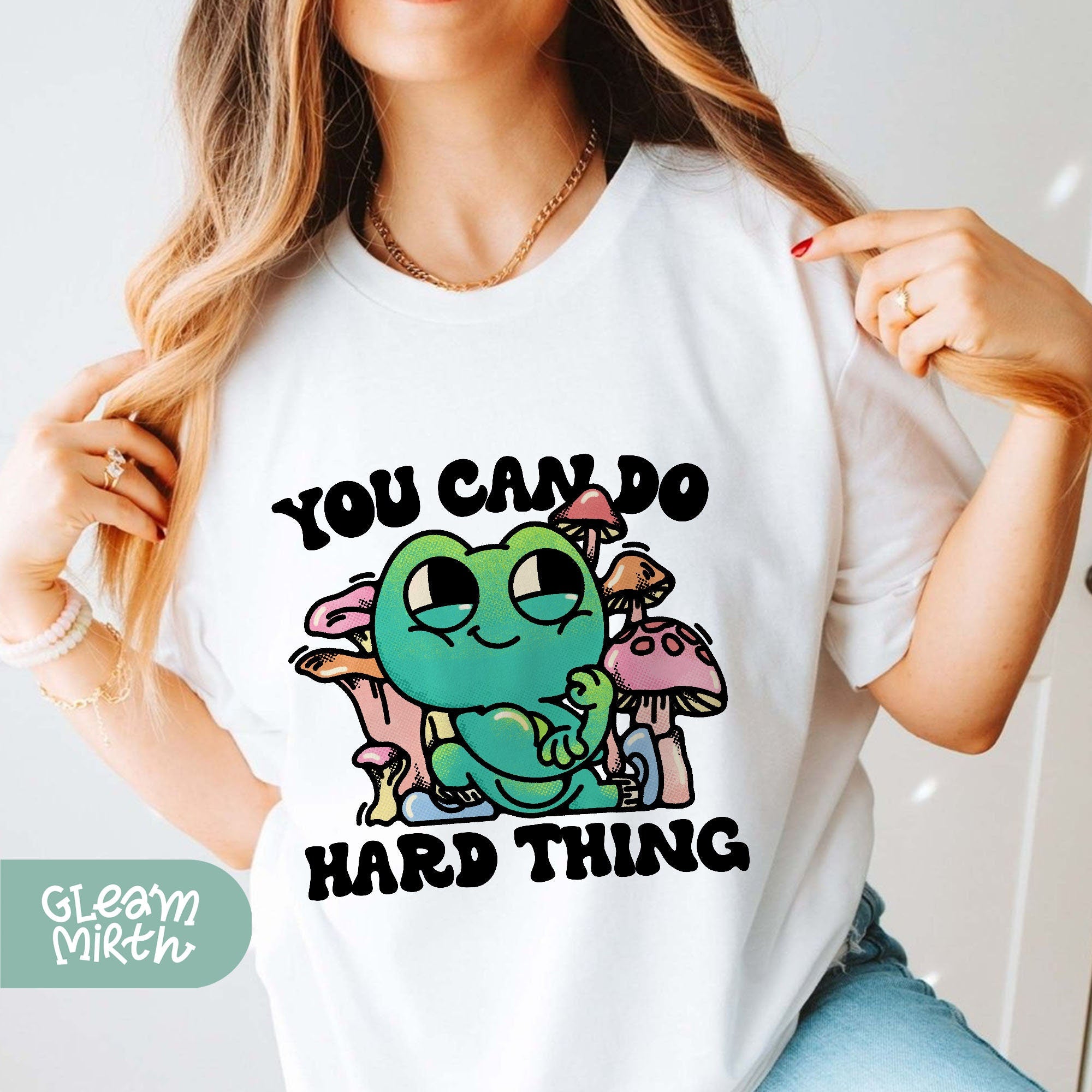 a woman wearing a t - shirt that says you can do hard thing