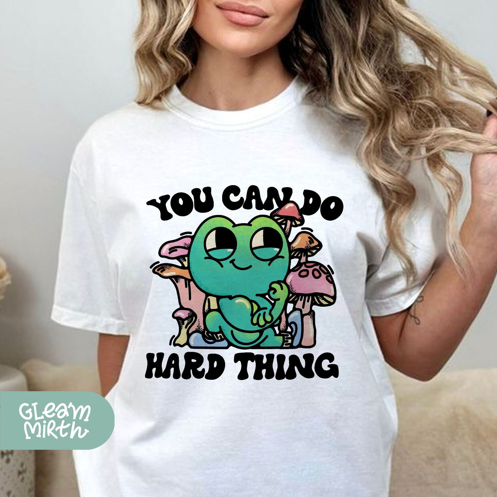 a woman wearing a t - shirt that says you can do hard thing