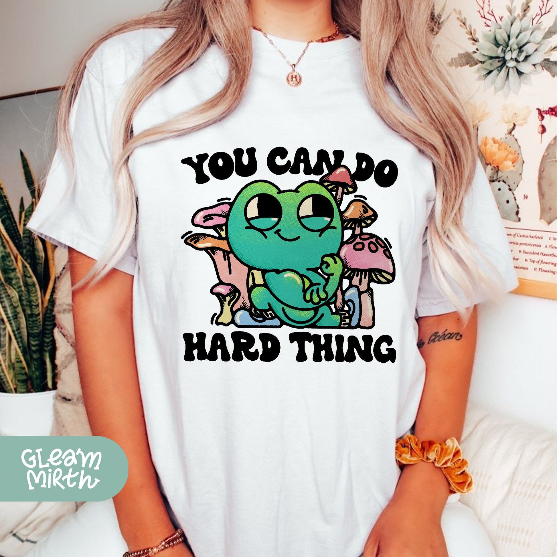 a woman wearing a t - shirt that says you can&#39;t do hard thing