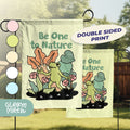 a pair of garden flags with dinosaurs on them