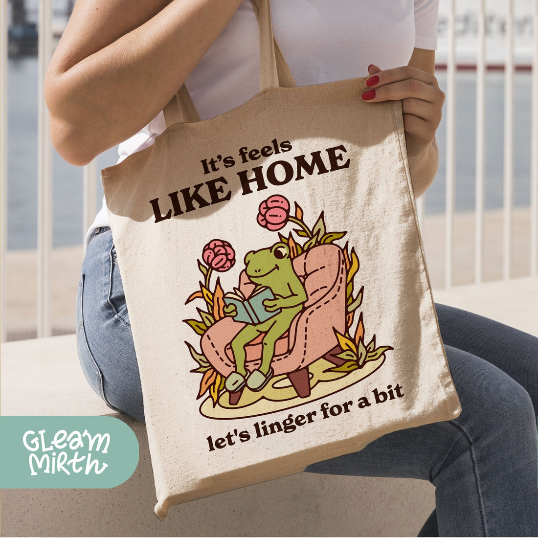 a tote bag with a frog sitting on a chair