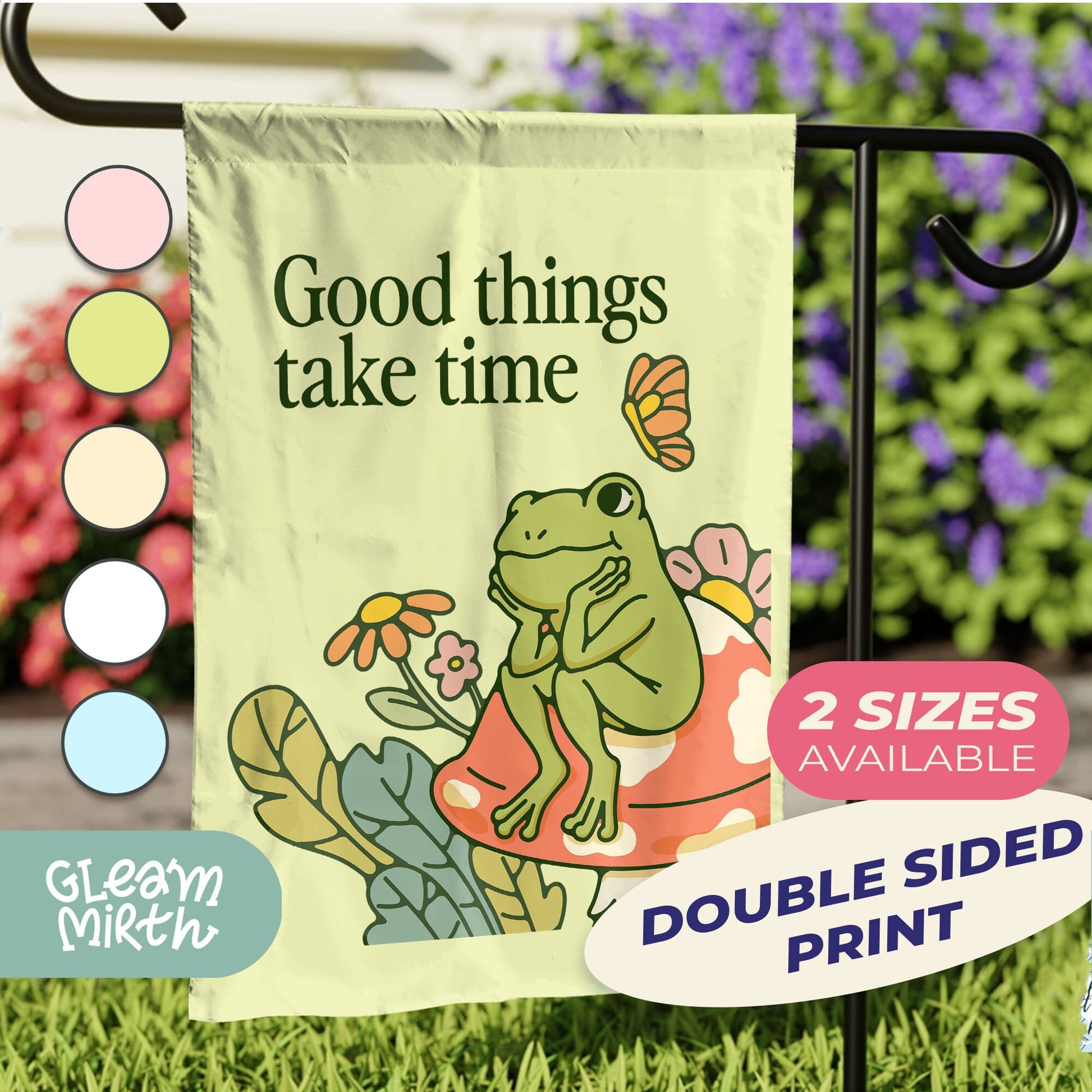 a garden flag with a picture of a frog on it